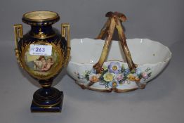 A Victorian Limoge mantel urn, cobalt ground with gilt decoration hand decorated panels of cherubs