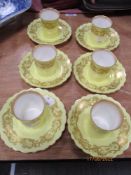 A set of six 20th century Royal Worcester coffee canisters and saucers Rdno. 204798. One saucer