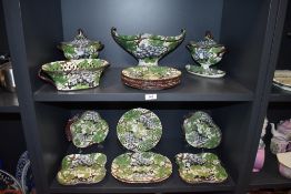An antique Davenport creamware dinner service having grapevine pattern with pearlware glaze having