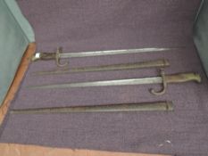 Two French Bayonets, Gras Rifle model 1874, with metal scabbards, one blade marked 1876 and other
