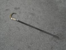 A Walking Stock 80cm in length having curved horn handle and white metal collar inscribed, Presented
