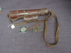 A WW1 three draw Telescope having leather covering and shoulder strap along with spare eye piece,
