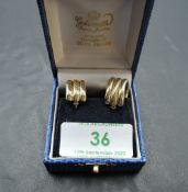 A pair of 9ct gold hoop earrings of triple hoop form, approx 3.9g