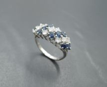 A sapphire and diamond seven row dress ring, total approx 1ct, having claw set panel mount on a