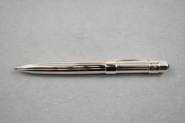 A Chaumet Ballpoint pen having ribbed stainless steel barrel and black faux gem stone detail to cap,