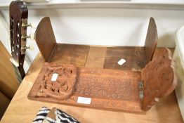 Two 20th century book shelf stands including Arts and Crafts style and Indian wooden carved