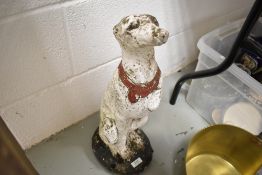 A garden figure of a Grey Hound dog