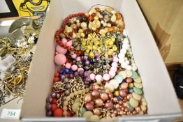 A tray of costume necklaces, beads etc