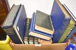 A selection of library volumes including Stalking Big Game