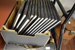 Two crates of library books and volumes including The Seafarers and Alistair Maclean