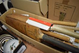 A selection of cricket bats and sports items