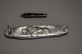 A Rostnever pocket knife with a miniature fruit knife having turtle shell handle