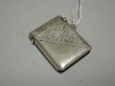 A George V silver vesta case, of traditional form with scrolled engraving, marks for Birmingham