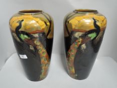 A pair of early 20th century Thomas Forester Phoenix Ware Princess Argus pattern vase decorated with