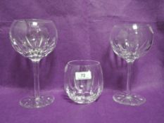 Two modern Cumbria Crystal wine glasses and a tumbler in the Sabre pattern