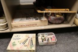 A selection of sewing and haberdashery items including three boxes of wool spools, lace making kit