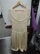 A cream silk 1930's dress