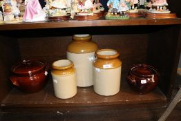 Two 20th century earthen ware crock pots with three salt glazed storage jars