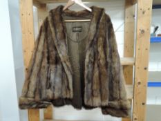 A short fur jacket,soft long pelt with longer guard hairs in a rich mahogany tone.