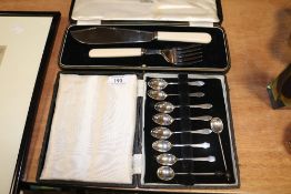 A selection of coffee spoons including four marked as HM silver along with a fish serving set