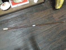 A modern silver topped walking cane, the plain silver tapering domed handle engraved with initials