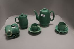 A mid-century Arts and Crafts style Moorcroft tea service in a green glaze