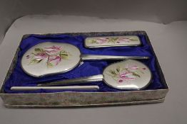 A mid century Delina four piece dressing table set