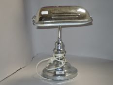 An Art Deco style modern desk top light with chrome finish