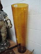 A large hand made amber glass vase 70cm tall