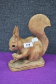 A wooden carved artisan study of a squirrel by J H Williams