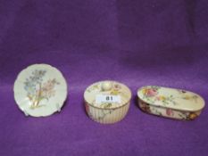 Three pieces of Royal Worcester including lidded trinket cases and a miniature pin dish