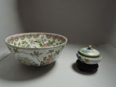 A modern Chinese styled fruit bowl with a lidded cloisonne bowl on stand