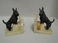 A pair of Art Deco onyx bookends with Scottie dog figures attached