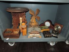 A selection of treen wood items including Indian folding table, model wind mill, mantel clock and