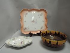 A cream ware bowl of shaped design with a Royal Doulton bowl and a porcelain tray