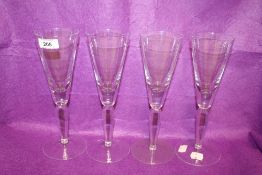 Four modern Cumbria Crystal wine glasses having a traditional design