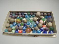A selection of childrens toy marbles some early examples including swirls and games balls