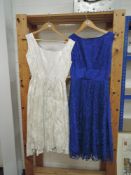Two 1950s dresses, one blue lace with gathered waist detail,the other of white brocade.