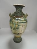 A 20th century Japanese vase decorated with scenes of river side boat and cranes