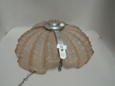 An Art Deco pink glass shell design ceiling light pendant