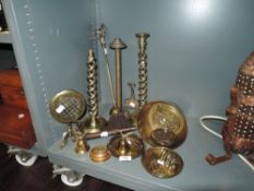 A selection of vintage brass wares including sauce pan, candle stick, poker holder and ash brush