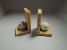 A pair of Art Deco era Onyx book ends with ball decoration.