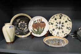 A selection of mid century and later studio pottery including decorated plates and Worthington