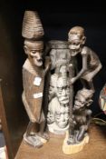 Three native African tribal wood carved figures including totem style stand and village eldar
