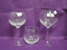 Two modern Cumbria Crystal wine glasses and a tumbler in the Six pattern