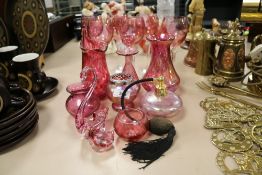 A selection of modern pink cranberry glass wares including wine glasses, lustre vase and Heron glass