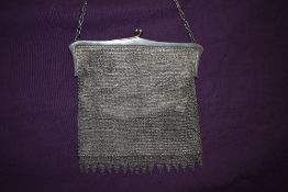 A circa 1920s chain bag lined in cream crepe and having clasp fastening.
