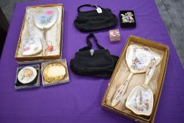 Two 1930s black evening bags, one with paste detail to clasp, a selection of compacts and ceramic