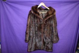 A vintage dark brown mink jacket.
