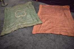 Two vintage cotton wool filled bed coverlets, one iridescent pink and the other green with champagne
